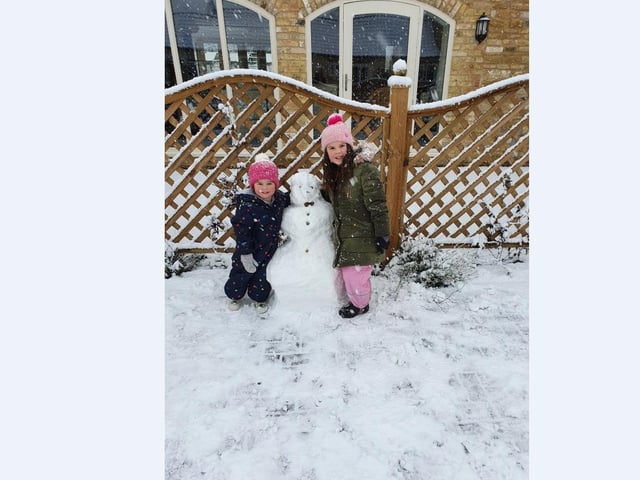 Aimee Nev and family get to work building their snow creations.