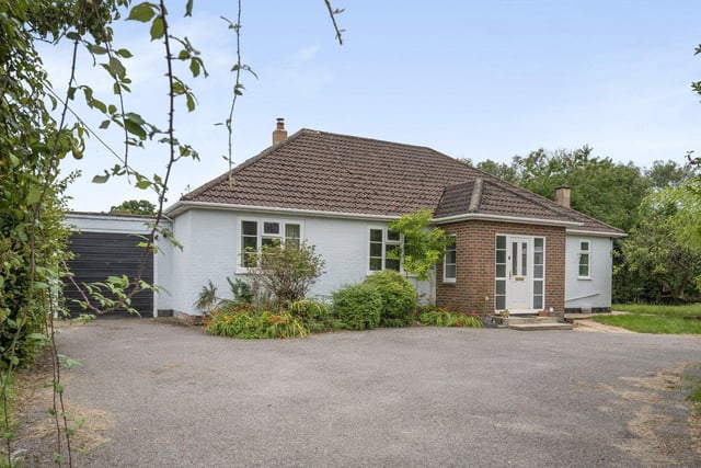 Netherdown is a large three bedroom chalet bungalow with two paddocks, stable blocks and field shelter. Price: £850,000.