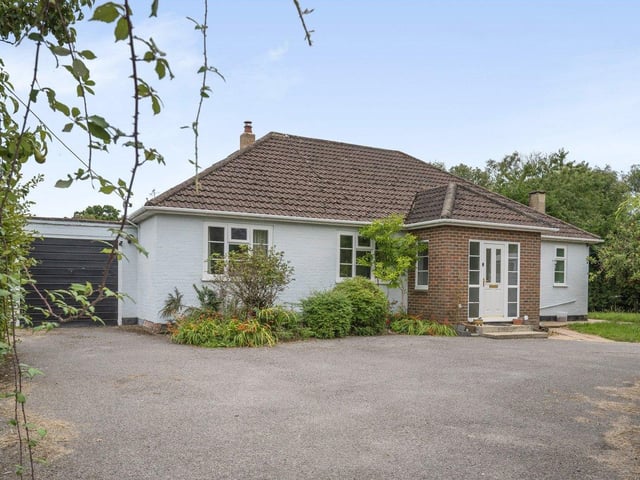 Netherdown is a large three bedroom chalet bungalow with two paddocks, stable blocks and field shelter. Price: £850,000.