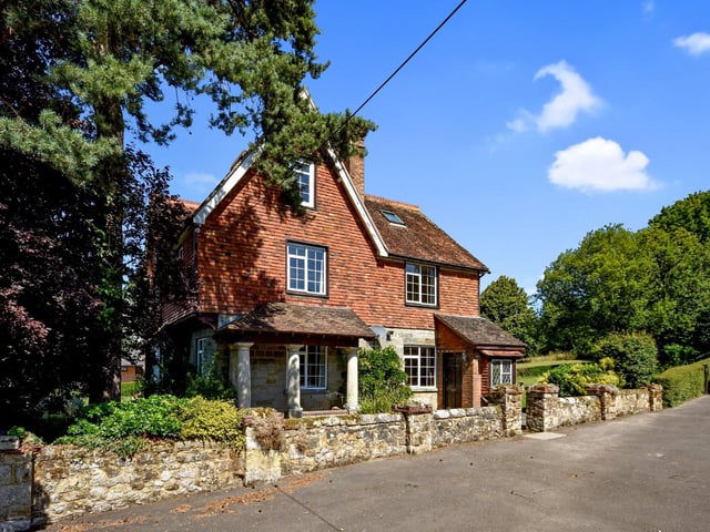 Water Mill House is a spacious five bedroom detached house with detached home office and five acres of gardens and paddocks. Price: £980,000.