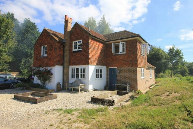 Woods End Cottage is an extended and improved detached period property with grounds of approximately 12 acres, including a field sub-divided into three paddocks. Price: £950,000.