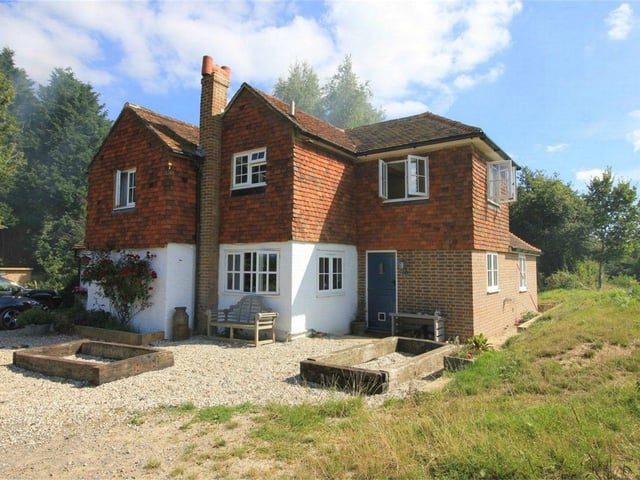 Woods End Cottage is an extended and improved detached period property with grounds of approximately 12 acres, including a field sub-divided into three paddocks. Price: £950,000.