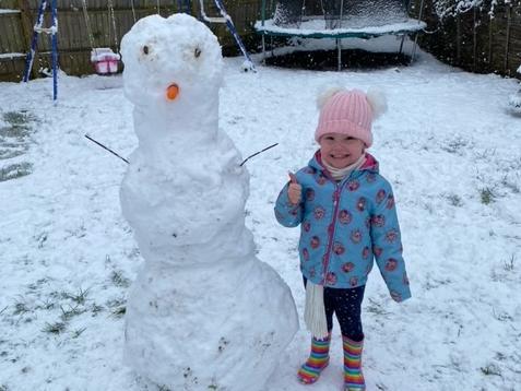 Mila-Rose with her snowman. Photo: Victoria Wright