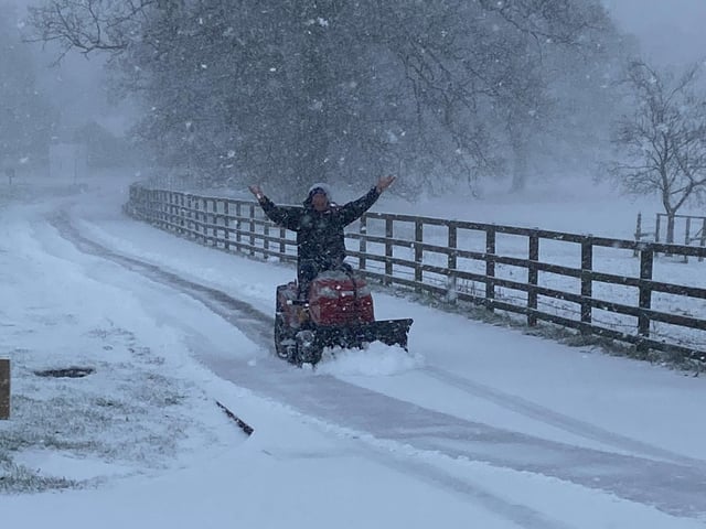 Mark Goodall clearing the snow at Badby Park neurological care centre in Daventry on his mini snowplow. Photo: Andrea Goodall