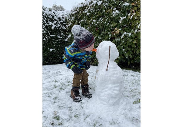 Rupert Welton, 3, couldn’t resist a bite of his snowman’s carrot nose yesterday (Sunday Jan 24)!
Photo by Sarah Welton.
