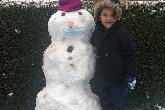 Helen Connolly Willis sent in this photo of her son Logan with his snowman.
