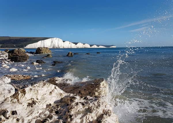 Sea spray crashes off the rock at Hope Gap, with the Seven Sisters in the background. Taken by Kieron Boyle, with a Samsung Galaxy S7. SUS-210127-135556001