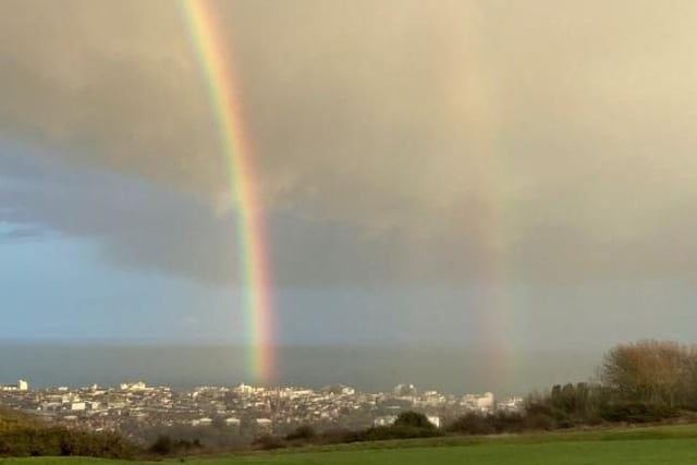 Double rainbow ending in the sea off Eastbourne seafront, by Ian Killick. SUS-210127-141212001