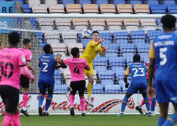 Christy Pym of Peterborough United punches the ball clear against Shrewsbury Town. Photo: Joe Dent/theposh.com.