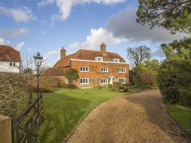 A handsome and historic Grade II listed house with two successful holiday homes, outbuildings and land of about 10 acres. Price: £1,675,000.