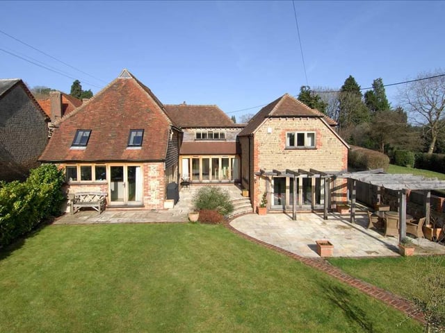 This stunning barn conversion offers a wonderful blend of character with modern benefits and approximately seven acres of paddocks/fields with a hay barn and stabling. Price: £1,600,000.