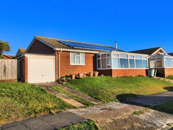A spacious three-bedroom detached bungalow situated in an elevated position within a mile from Bishopstone railway station, the sailing club and Esplanade.
The accommodation comprises lounge/diner, kitchen, conservatory, sun room, family shower room, master bedroom with en suite bathroom and two more bedrooms.
Price: £440,000