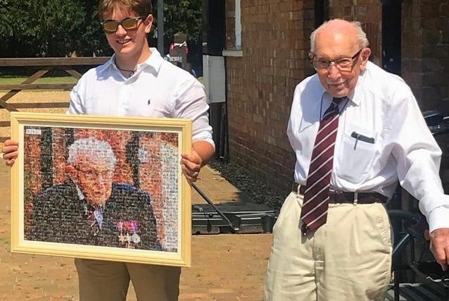 Captain Tom, pictured with his grandson Benjie, was presented with a national salute mosaic from the BBC
