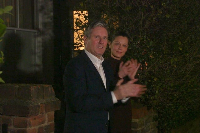 Screengrab taken from PA Video of Labour leader Sir Keir Starmer and his wife Victoria outside their London home as they join in with a nationwide clap in honour of the 100-year-old charity fundraiser who died on Tuesday after testing positive for Covid-19. Picture PA Wire/PA Images.