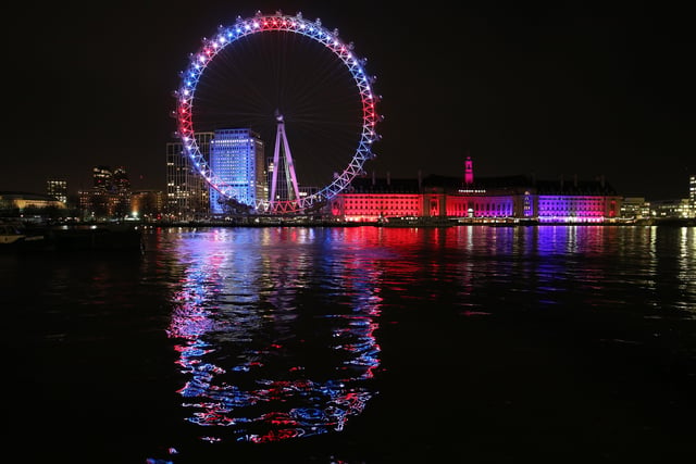 The London Eye and buildings along the South Bank are lit up with the colours of the Union flag, during a nationwide clap in honour of Captain Sir Tom Moore. Picture: PA Wire/images.