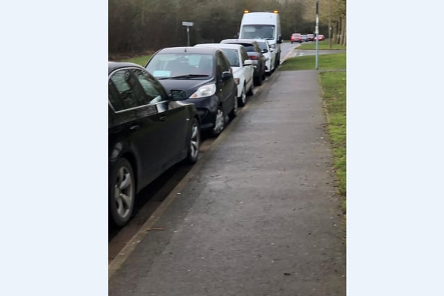 Cars parked outside of the vaccination centre at Orton Wistow.