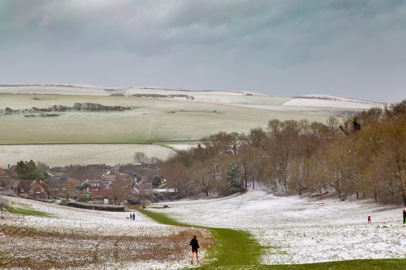 East Dean village with joggers and sledgers enjoying the weekend’s snow. Barry Davis took this shot on a Canon 5d. SUS-210902-105649001