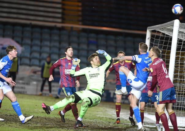 Posh skipper Mark Beevers (right) couldn't quite reach this ball following a home corner. Frankie Kent (left) looks on. Photo: David Lowndes.