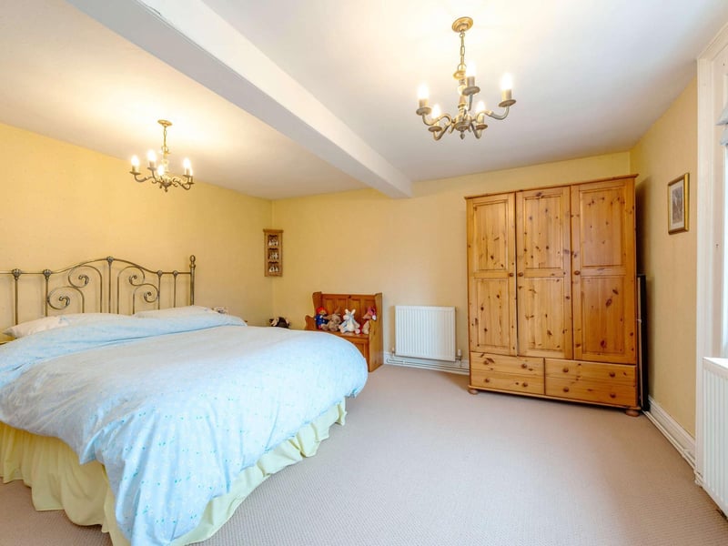 The guest bedroom is a large double room benefitting from fitted wardrobes and a shower room en suite.