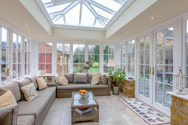 The airy conservatory provides lovely views of the landscaped gardens