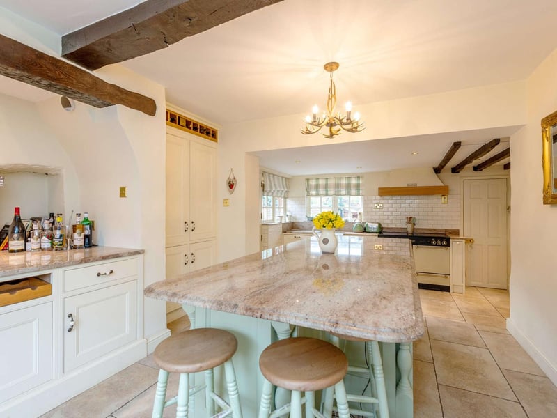 The kitchen breakfast room has recently been renovated and has a bespoke handmade kitchen by Woodworks. A central island with integrated double drawer fridge and breakfast bar. Integrated appliances and a Rangemaster 110 cooker range. The room has a breakfast area with space for a table and chairs and a window seat.