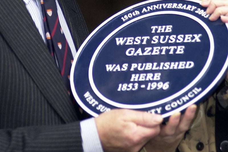 This West Sussex County Council blue plaque shows that the West Sussex Gazette was pubished 1853 - 1996 at a building on the south west side of the High Street in Arundel.