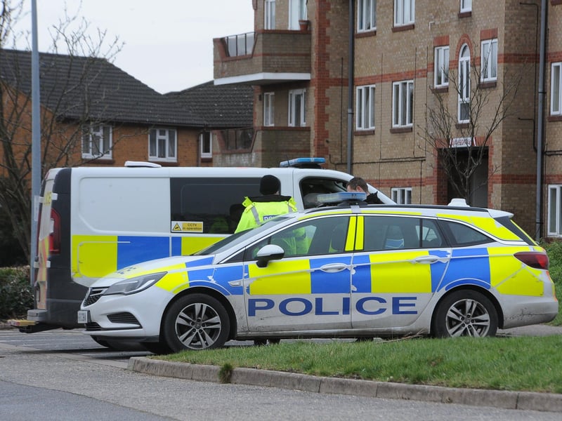 Police vehicles near The Fleet Complex close to the entrance to Fletton Lake.