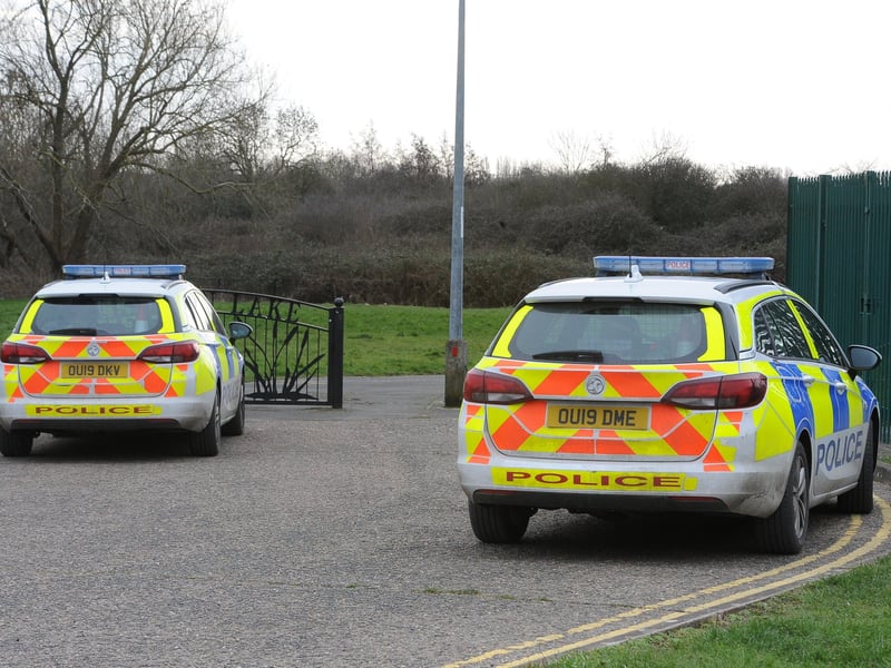 Police vehicles near The Fleet Complex close to the entrance to Fletton Lake.
