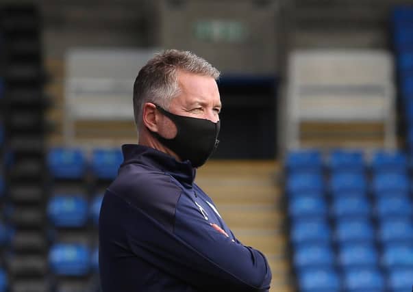 Rival promotion-chasing managers Darren Ferguson (Posh, left) and Karl Robinson (Oxford).