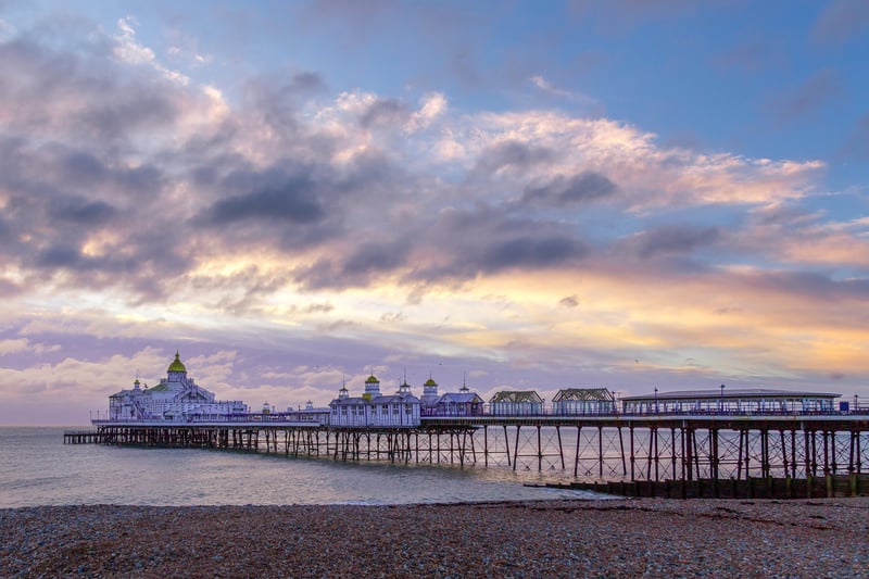A cold winter's dawn breaks over Eastbourne Pier and beach. This photograph was taken by Barry Davis on a Canon 5D camera. SUS-210217-105018001