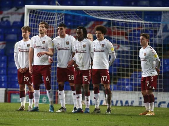 Cobblers line up to defend a free-kick. Pictures: Pete Norton.