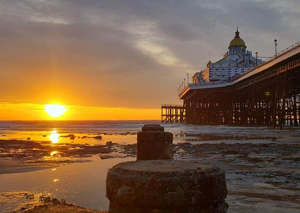 Cold January sunrise at low tide on the beach by Eastbourne Pier, taken by Tara White on an S9 phone. SUS-210217-095857001