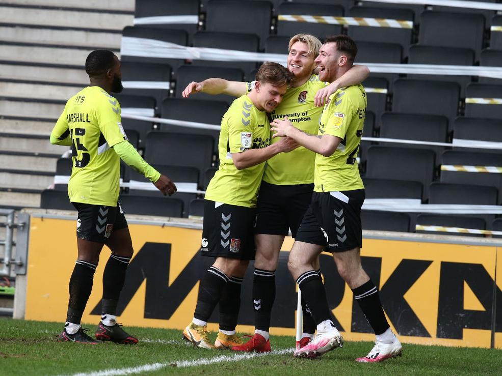 Cobblers celebrate Ryan Watson's super strike just a minute into the second-half. Pictures: Pete Norton.