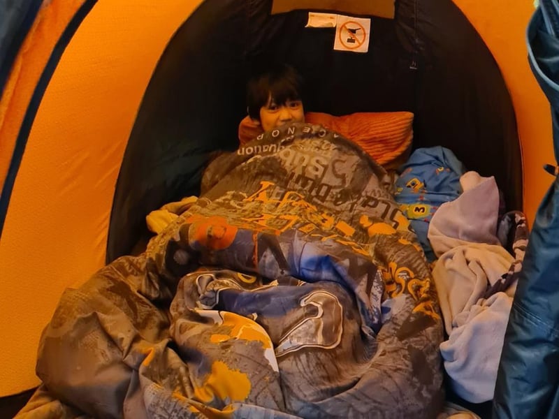 Jamie in a tent
