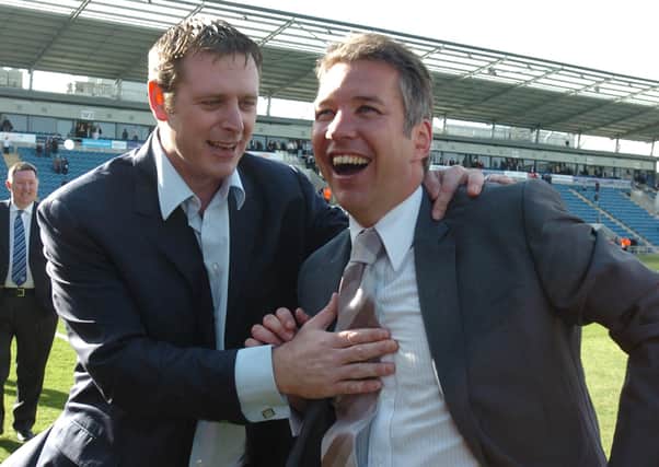 Posh chairman Darragh MacAnthony and manager Darren Ferguson celebrate promotion to the Championship after a 2009 win at Colchester.
