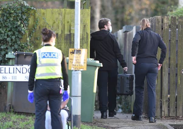 Police officers entering a property  at Ellindon, North Bretton. Pictures: David Lowndes