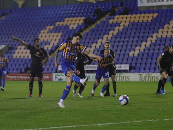 Ollie Norburn fired in Shrewsbury's second from the penalty spot