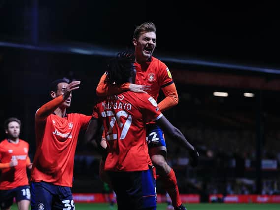 Luton celebrate Elijah Adebayo's opening goal for the Hatters on Tuesday night