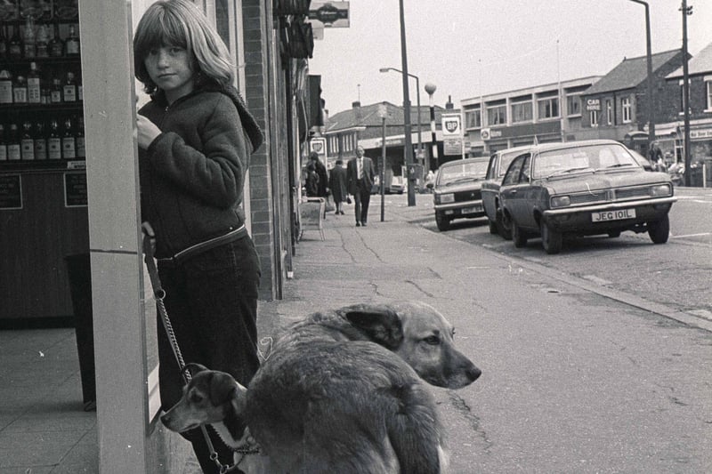 Do you know the young lady pictured with her dogs?