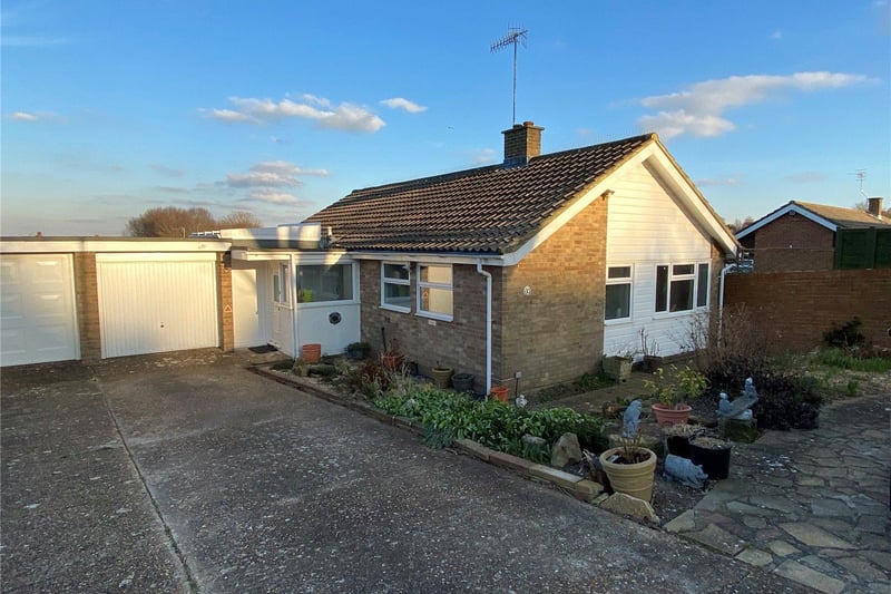 A spacious linked detached 2/3 bungalow with delightful gardens and outstanding views.