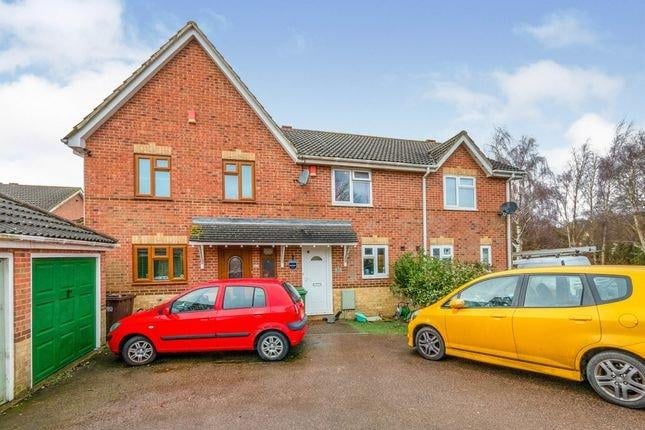 Terraced house, lounge, fitted kitchen, two double bedrooms, one family bathroom, private rear garden, garage access. Price: £240,000.