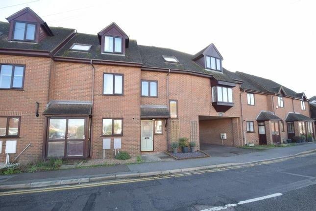 Modern town house, kitchen, lounge, three bedrooms, one bathroom, integral garage, double glazing and sea view. Price: £250,000.