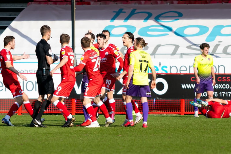 Crawley Town players protest to the referee