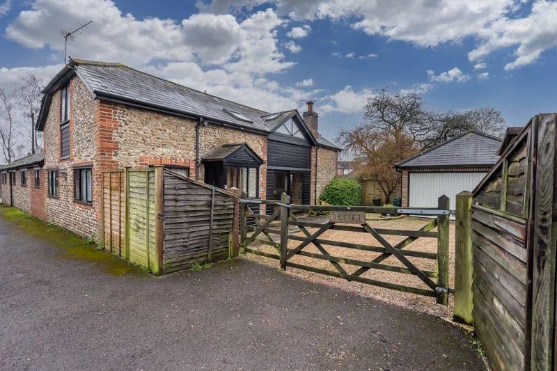 An unusual attached three bedroom barn conversion. Price: £499,950.