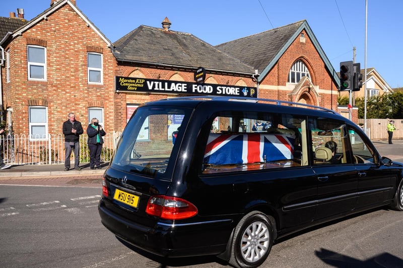 The funeral procession for Sir Tom Moore passes through Marston Moretaine on the way to Bedford Crematorium ahead of the private ceremony (Photo by Leon Neal/Getty Images)
