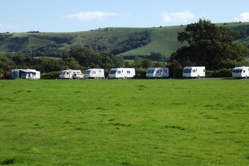 Family friendly campsite at the foot of the South Downs, disability friendly, modern toilet/shower facilities with separate baby changing facilities, tuck shop, fire pits/barbecues, children's play area.