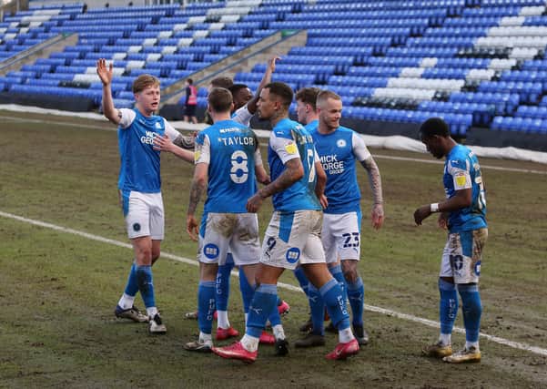 Posh players celebrate the winning goal against Wigan at the weekend. Photo: Joe Dent/thposh.com.