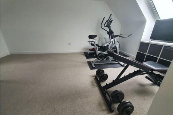 This spacious room is currently being used a home gym, but this space could easily be converted into whatever best suits your needs given its size.