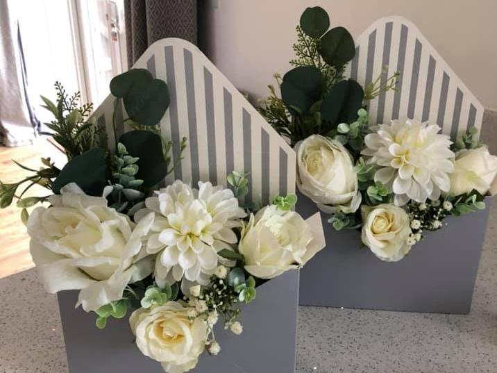 These stunning artificial flower envelopes were made by 'Blossom Meadow'. Clare also makes hatboxes, frames, pretty hanging ceramics and more! For more information, visit her Facebook page.