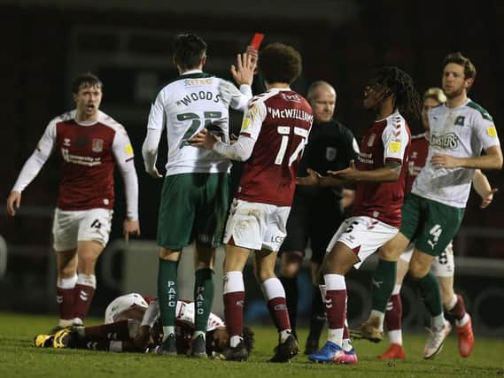 Plymouth's Sam Woods was sent off for a poor challenge on Ricky Korboa in stoppage-time, but by then Cobblers had the points sewn up. Pictures: Pete Norton.